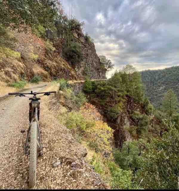 Gravel road cut into a canyon wall above the Yuba